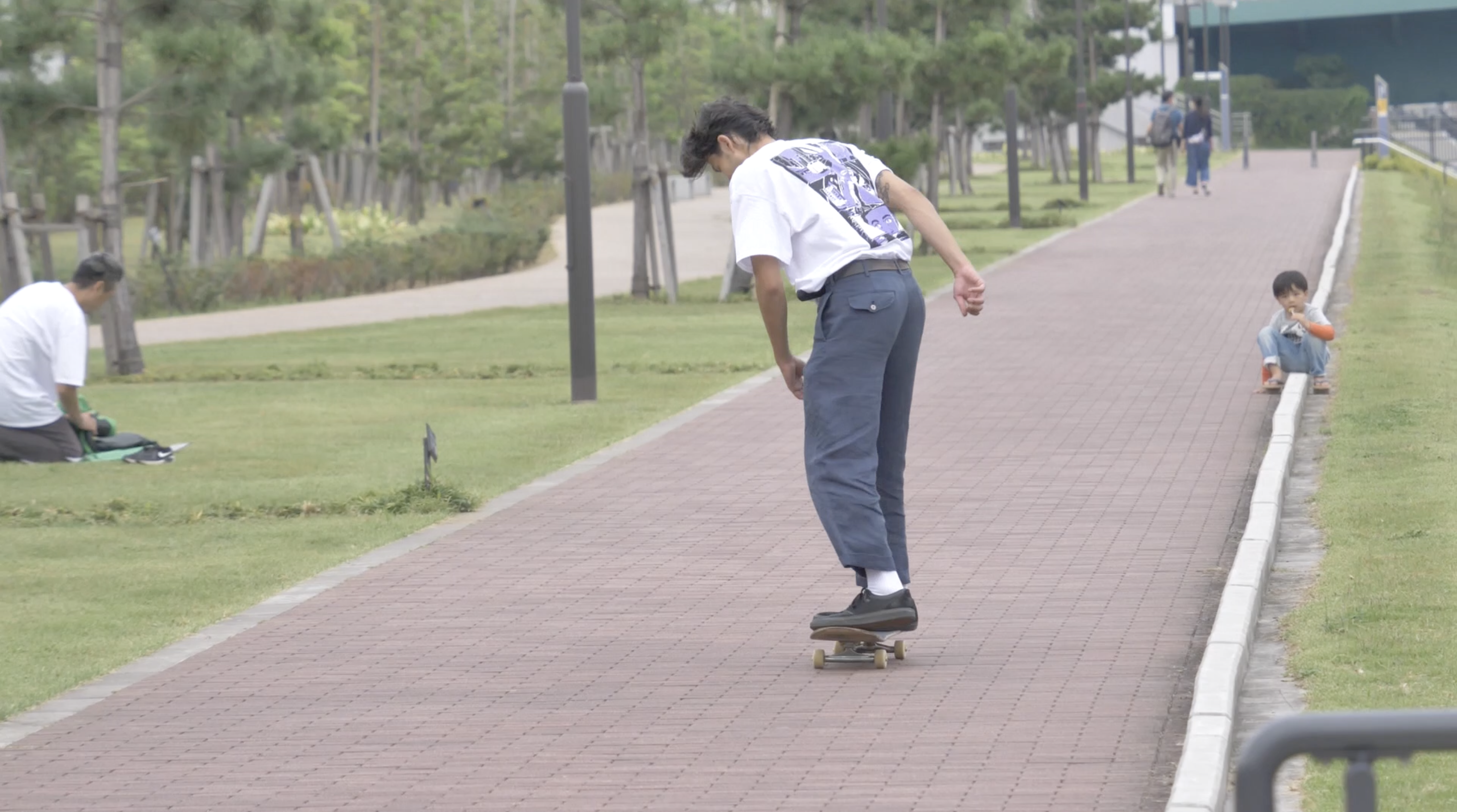 Skater wearing WAFFLESNCREAM shirt